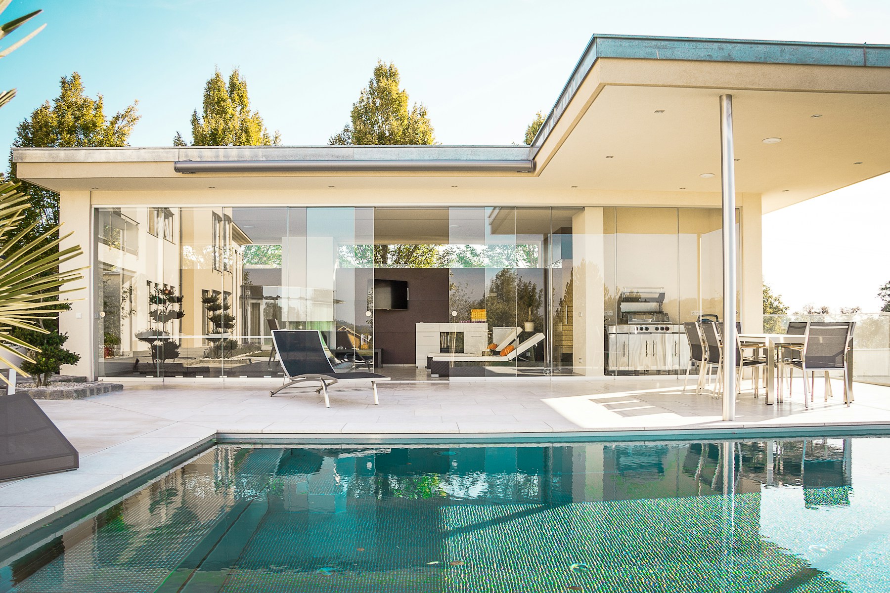 Elegant outdoor living area next to a swimming pool